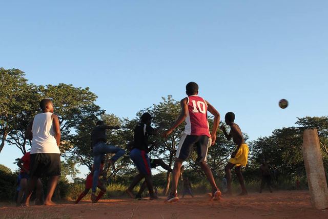 Young people playing football