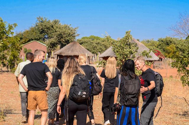 Volunteers walking through a village