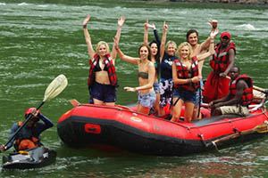 Volunteers cheering on a raft on the Zambezi