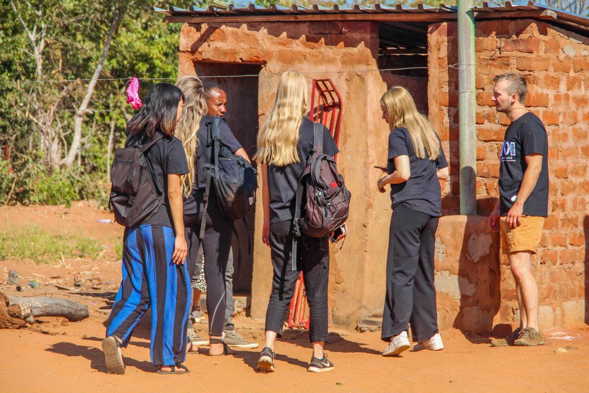 Volunteers at brick pit latrines in a village